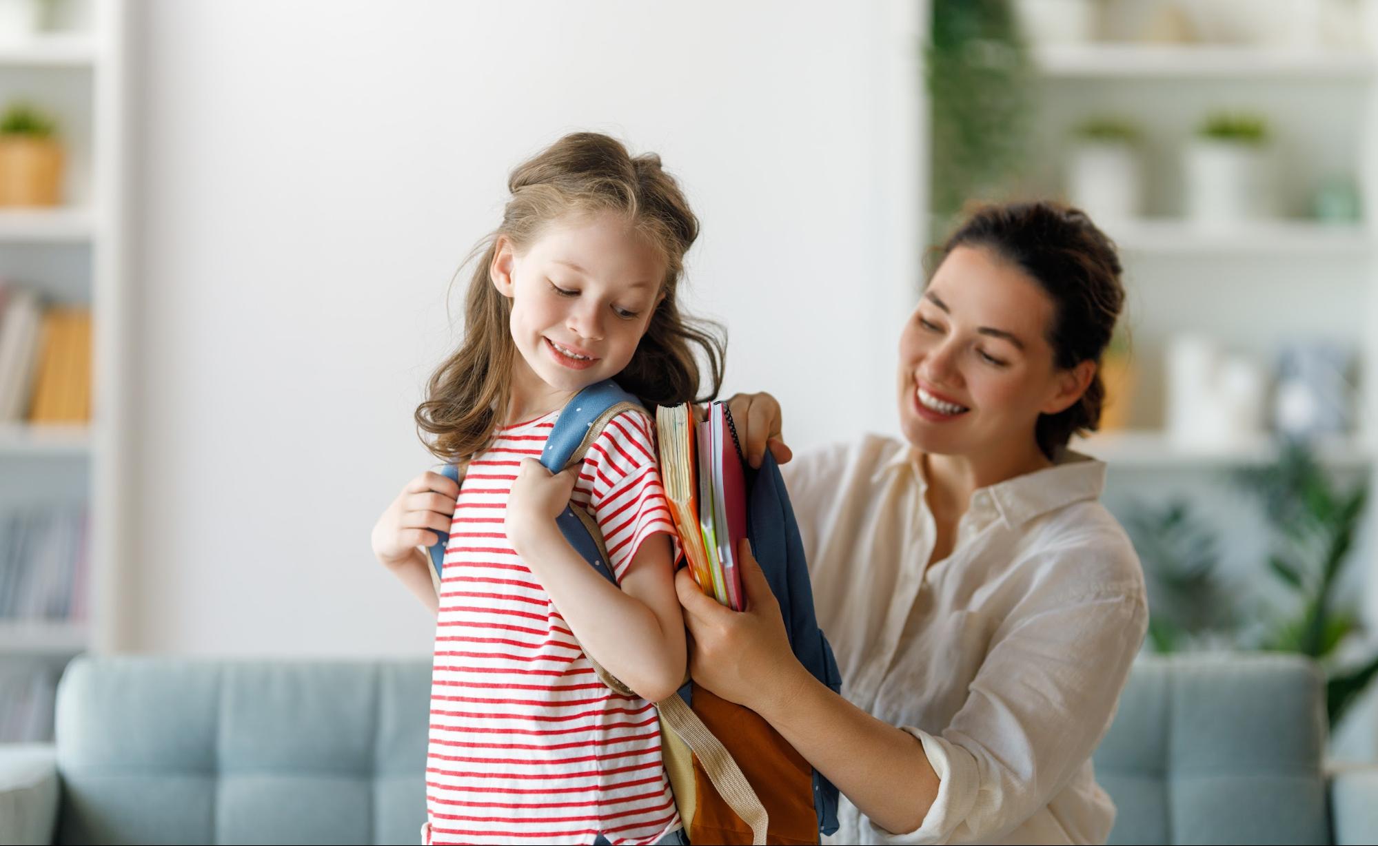 Mom getting daughter ready for school in their new home in Metro Atlanta ©Yuganov Konstantin