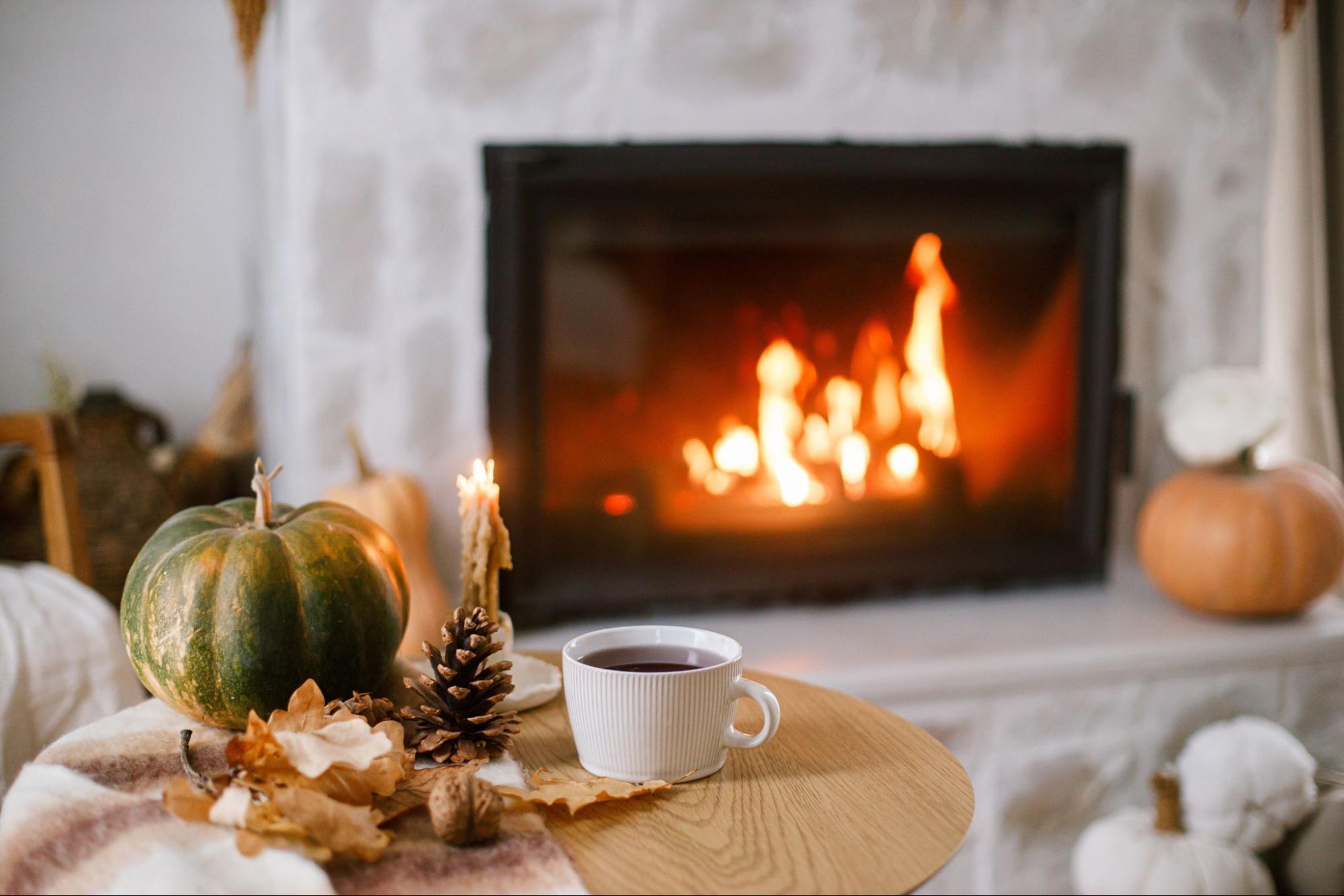 Fall-themed decor in a new home family room with a fireplace. ©Bogdan Sonjachnyj