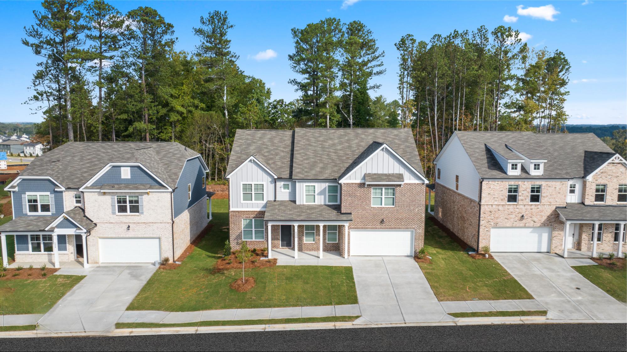 Row of new brick homes at Alcovy Village in Lawrenceville, GA, built by Rockhaven Homes.